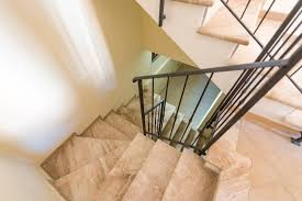 Remove staples left from the carpet installation with pliers. 6 Best Flooring Types For Basement Stairs Home Decor Bliss