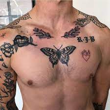 Butterfly And Other Black Tattoos On The Chest Chest Tattoo Men Black Butterfly Tattoo Tattoos