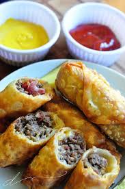 Take This Bacon Cheeseburger Spin On Your Ordinary Eggrolls These Eggrolls Are Filled With Bacon Cheese And Hamburger The Guys Wi Recipes Food Beef Recipes
