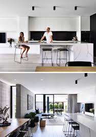 Jamison Architects Have Designed A Contemporary Duplex With Concealed Garages And An Open Plan Interior Modern Kitchen Design Black Backsplash Kitchen Island With Seating