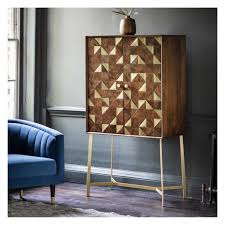 With legs made of satin brass and distinctive dark walnut cabinetry, this chic cabinet is one of the most sophisticated storage options for glass storage and bar accessories. Large Brushed Brass And Wood Geometric Double Drinks Bar Cabinet On Gold Legs 84 X 43