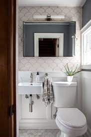The two biggest obstacles are providing ample headroom and ventilation. How To Tile A Small Space On A Budget Tiny Powder Rooms Small Bathroom Colors Bathroom Design Guide