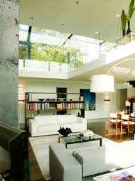 A high ceiling living room with exposed wooden beams complemented by a large industrial ceiling fan. 80 Ideas For Contemporary Living Room Designs