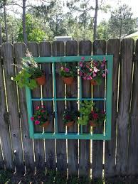 An old window frame is transformed into a shadow box with lights. 40 Fun And Inspiring Old Window Outdoor Decor Ideas To Make Your Yard Shine Unique Garden Decor Outdoor Window Decor Outdoor Fence Decor