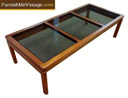This particular table is of the lighter teak variant and some minimal wear around the brass plate detailing. Vintage Danish Teak Coffee Table With Inset Glass