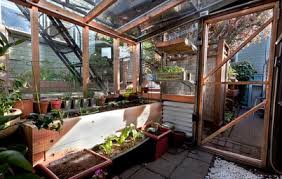 This charming little greenhouse is made from 4 window panels and 2 plywood panels. Warm Up A Greenhouse For Winter
