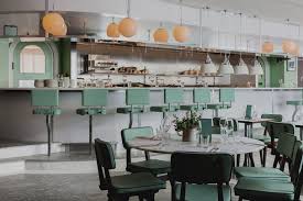 Red Deer Architects Design Pistachio Green Deli And Restaurant For New Lina Stores At King S Cross Mix Interiors In 2020 House Made Interior Architect Design
