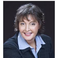 This charming decorative platter features a scenic landscape painting of a  farmhouse surrounded by colorful flowers by Susan Winget. Done in blues,  purples and greens. Its artistic design adds a touch of