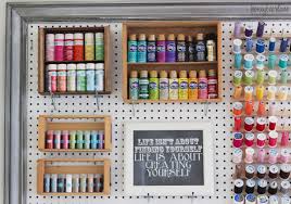 Organize paint by color and store in small hanging basket. Extra Large Pegboard For Craft Room Organization