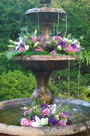 Blooming smiles frances florist athens ga flowers best local. I Do Flowers Lilies Roses Greenery Wedding Fountain Garden Design Garden Fountains Charming Garden