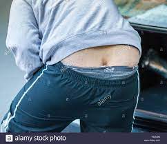 builders ass bum crack man showing rear end view Stock Photo - Alamy