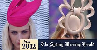 Mad hatter blocks femiman's headpiece