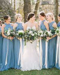 The addition of a wrapped bouquet opens up a whole new world of customizable options for your wedding, and it's a style we're definitely here for. Blue Bridesmaid Dresses White Wedding Bouquets With Long Ribbons