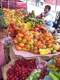 A Fruit Seller In Mexico World Food Market Mexican Food Recipes Fresh Food Market