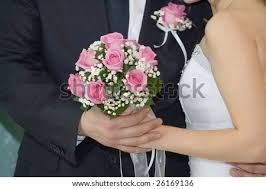 Our dedicated team of expert wedding florists will help you bring your vision to life and will make sure to add those important personal touches for the bride and groom, bridesmaids. Rose Flowers Wedding Bouquet Hands Of Bride And Groom Traditional Black And White Wedding Dress Stock Images Page Everypixel