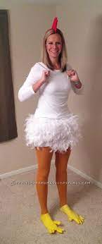 This diy chicken costume was made with 2 white feather boas and 2 sets of yellow rubber gloves. Each Year For Some Reason I Am Drawn To Animal Costumes Maybe It Is Because I Work W Chicken Costumes Cool Halloween Costumes Creative Halloween Costumes Diy