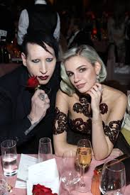 She elaborated on those accusations a week later, at which point she also said that manson's wife, lindsay usich, and someone named leslee lane were conspiring to release photos of me when i was underage, after being given large amounts of drugs and alcohol, after brian performed on halloween in las vegas, to 'ruin my career' and 'shut me up.' Marilyn Manson Manson Source On Twitter Marilyn Manson And Nikita Andrianova At The Fashion Awards London 05 12 2016 Marilynmanson