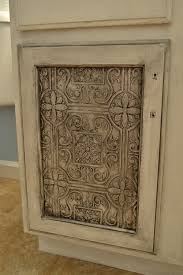 I Am So Doing This For My Cabinet Doors Faux Tin Tile Wallpaper On Cabinet Doors Sprayed With Krylon S Bright Meta Meuble Idees Pour La Maison Decoration