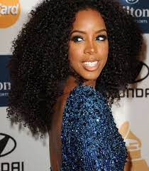 It involves curling the top hair and shaving the sides if the head. Black Hair At The 2012 Grammy Awards Weave Hairstyles Curly Weave Hairstyles Womens Hairstyles