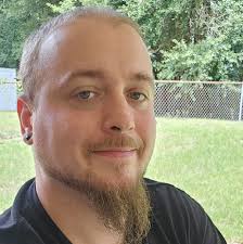 What could be causing my Mercedes E500 to idle rough and have low RPMs?