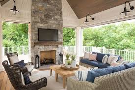 Screened Porch With Stone Fireplace Vaulted Ceiling And Coastal Farmhouse Lighting Outdoor Living Rooms Porch Fireplace Outdoor Rooms