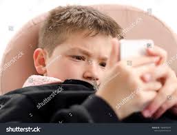 Completely Absorbed Little Boy Playing Mobile Stock Photo 1066842047