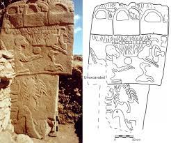 Pillar 43 at the 12,000-year-old Göbekli Tepe in Turkey, decorated with the  carvings of 3 handbag-shaped objects (architectural structures?), a vulture  with a sphere balanced on its wing, other birds, a snake,