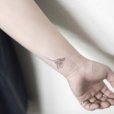 Tiny Flower Tattoo On Wrist By Hongdam Flower Wrist Tattoos Tattoos Wrist Tattoos For Guys