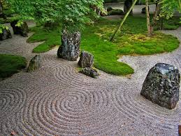 The Japanese Rock Garden Or Zen Garden Creates A Miniature Stylized Landscape Through Carefully Composed Arr Mini Zen Garden Japanese Rock Garden Japan Garden