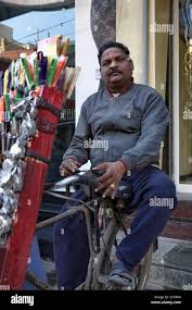 Indian man sharpening knife hi-res ...