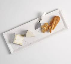 White marble slab is polished to a shine. White Marble Cheese Charcuterie Board Pottery Barn