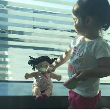 She includes a removable diaper; Baby Stella Brown Doll With Black Hair Manhattan Toy