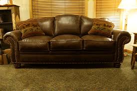 A gallery featuring a wide variety of sophisticated living room designs featuring leather furniture. Distressed Leather Sofa Chair And Ottoman