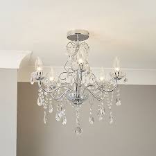 In a dining room, a beautiful chandelier will create a sense of class and formality, even if the furniture in the space isn't exactly formal. Intelli Chandelier Transparent Chrome Effect 5 Lamp Bathroom Ceiling Light Tradepoint
