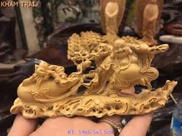 Tượng Di Lặc kéo bao để ô tô gỗ Hoàng Dương đục tinh xảo, sắc nét