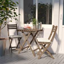askholmen table 2 chairs outdoor grey brown stained ikea in 2020 used outdoor furniture outdoor chairs wooden outdoor furniture