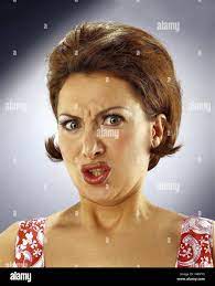 Woman, young, brunette, facial play, disgust, portrait, women, studio,  disgust, revolting, hideously, repeling, aversion, view camera, eyes, brown  Stock Photo - Alamy