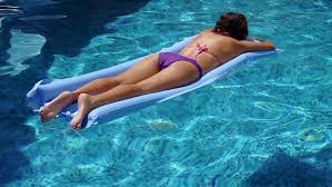 If you have to arrange a swimming pool area, this mattress will perfectly accessorize your relaxation area. Latin Girl Relaxing On Inflatable Stock Footage Video 100 Royalty Free 14894635 Shutterstock