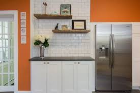 orange kitchen walls surrounding white