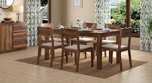 The wall decors add class to the room. Brighton Large Kerry 6 Seater Dining Table Set Urban Ladder