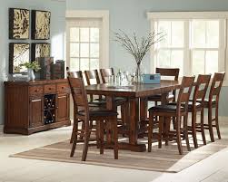 #eastwestfurniture 5 piece moderate rectangular counter height table together with four solid hardwood stools finish in a warm buttermilk and cherry color with wood seat. Zappa 5 Pc Counter Height Dining Table Set Mega Furniture Usa