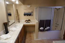Cut down on the tiles. Inexpensive Bathroom Remodeling Ideas For 2021