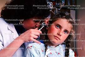 Doctor and girl patient, ear examination, otoscope, Photo