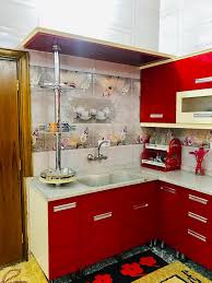 كاونتر مطبخ لون أحمر مع تطعيم لون كريمي ديوان تكريت للمطابخ Facebook