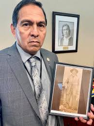 Holding a photo of my...