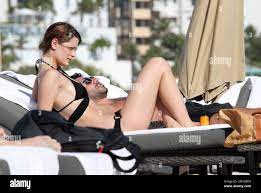 Looking slim and healthy, actress Mischa Barton shows off her beach body in  a black bikini as she lounges on South Beach with a male companion while on  holiday during the week
