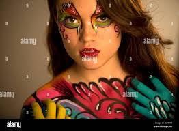A model poses during a body painting session with make-up artist Erika  Monroy, founder of Akin Body Painting, in Toluca, Mexico Stock Photo