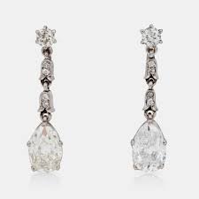 A pair of pear shaped and brilliant-cut diamond earrings. Made by Swedish court  jeweller W.A. Bolin, Stockholm 1953. - Bukowskis