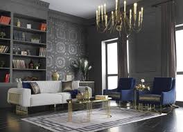 Modern look living room features white sofas with dark decorative pillows facing over rectangular grey ottoman. Nirvana Gold Sofa Set Luxe Life
