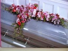 It is usually designed to cover half of the casket and can be made using a variety of. Old Rugged Cross Casket Blanket Funeral Flowers In Centreville Al Cahaba Flowers